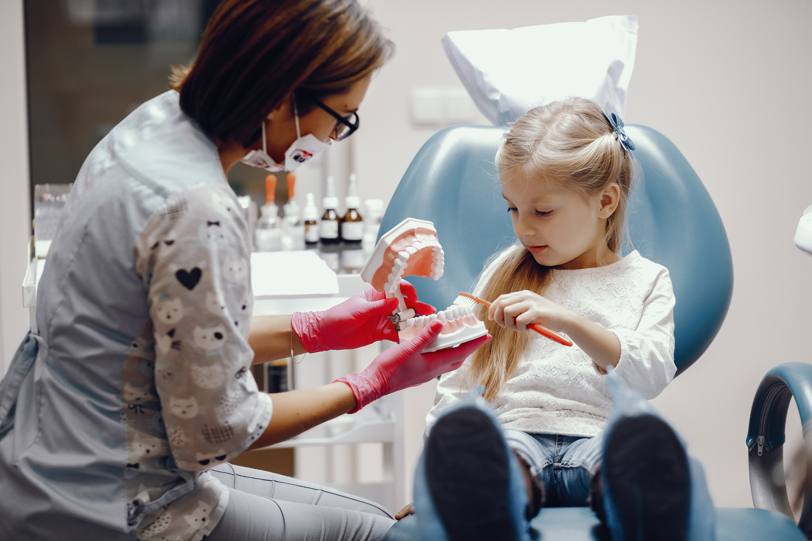 Child receiving a routine dental checkup to support healthy teeth and gums