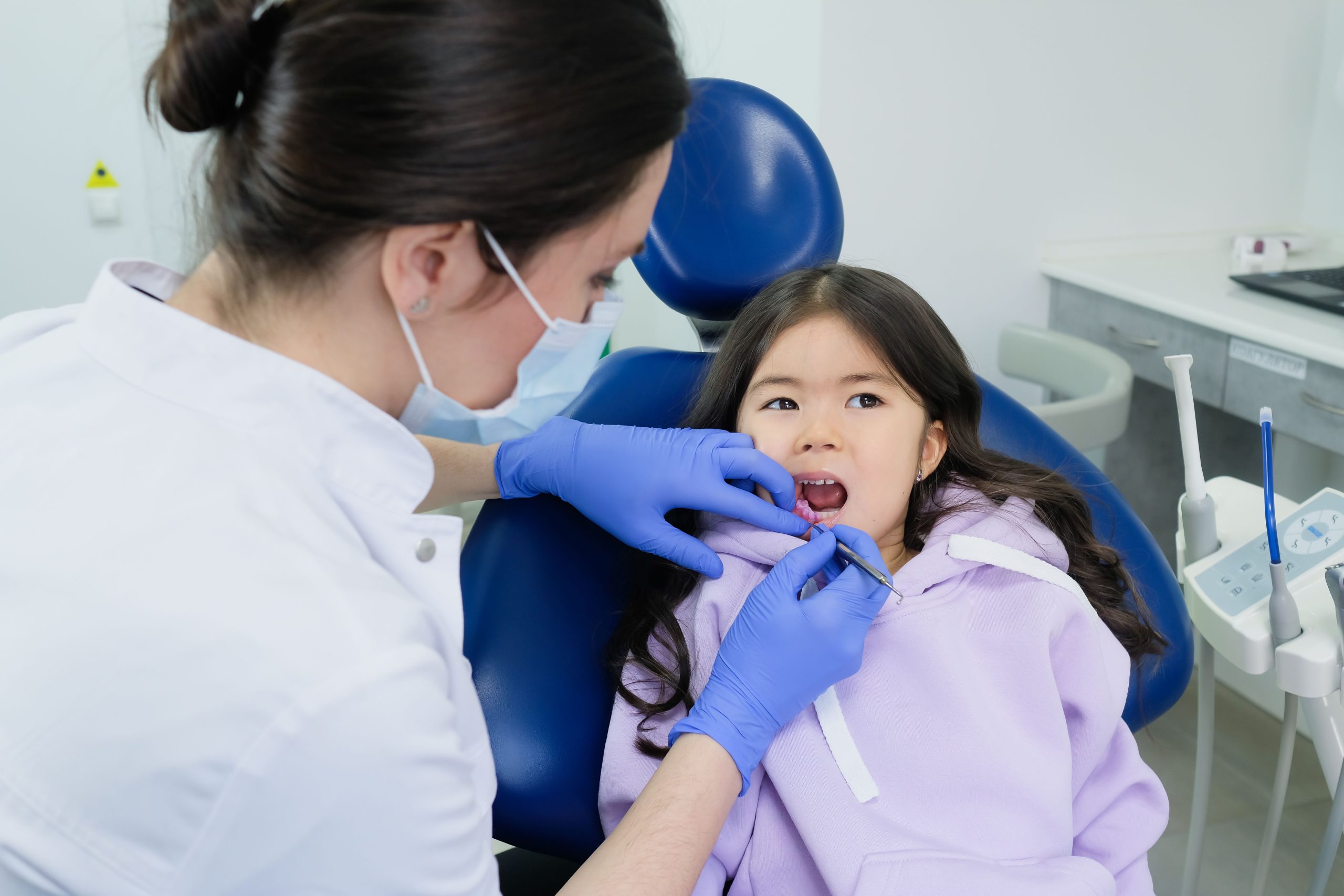 Child receiving emergency dental care for a dental injury